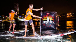 Stand Up Paddle racing at night