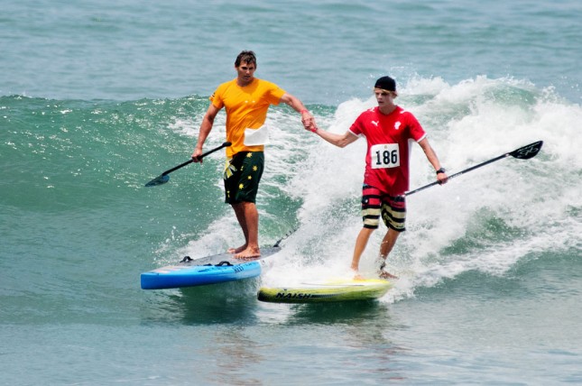 Jamie Mitchell Casper Steinfath high five ISA Stand Up Paddle World Championship Peru