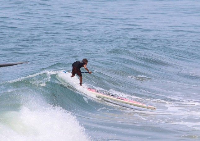 Stand Up Paddle racing in the waves