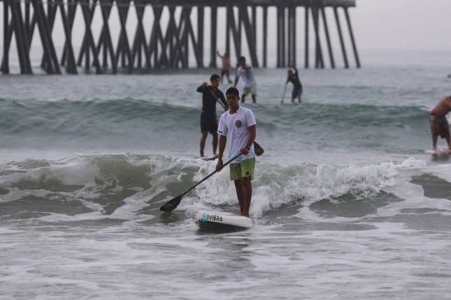 stand up paddling in the waves